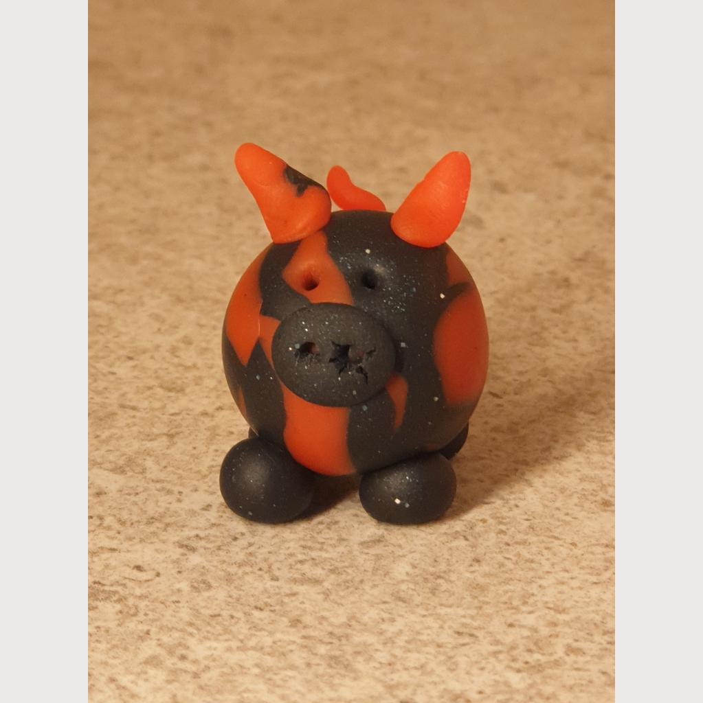Glücksschweinchen aus Fimo schwarz/rot