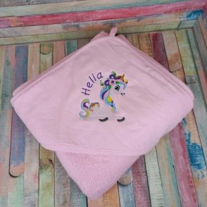 Dreiecksbadetuch Einhorn sitzend