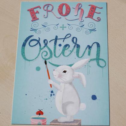 Osterkarte Osterhase malt Frohe Ostern